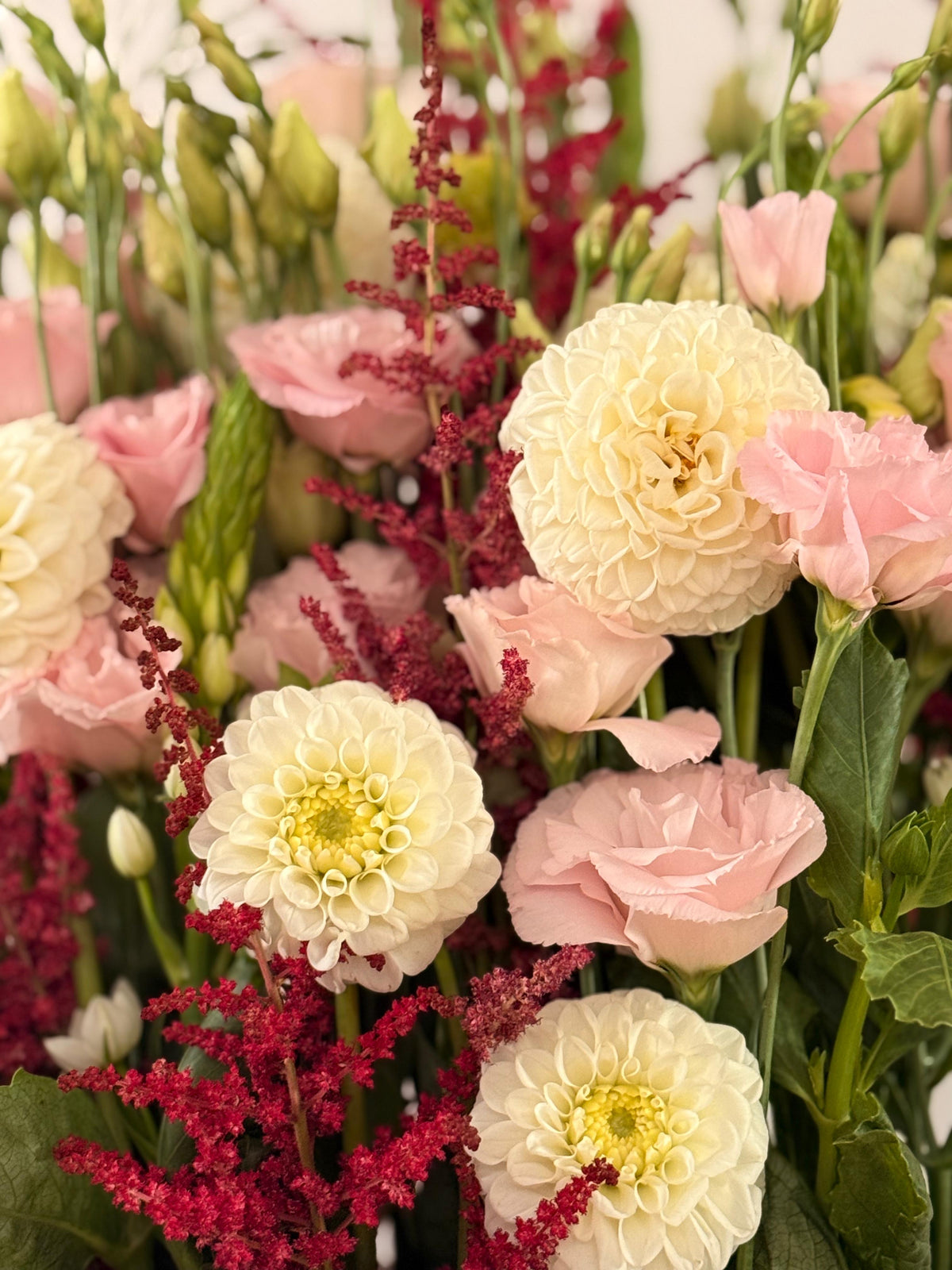 Pink lisianthus, white dahlias, and red astilbes box